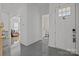 Inviting entryway with tiled floors and views into other rooms of the house at 2117 Middlebridge Ct, Fort Mill, SC 29715