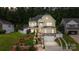 Charming two-story home with manicured landscaping and a two-car garage at 2117 Middlebridge Ct, Fort Mill, SC 29715