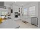 Bright kitchen features stainless steel appliances, white cabinetry, and tile backsplash at 2117 Middlebridge Ct, Fort Mill, SC 29715