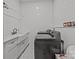 Laundry room with a farmhouse sink, white cabinets, and a large washer and dryer at 2117 Middlebridge Ct, Fort Mill, SC 29715