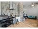 Bright living area showcasing a stainless steel grill, tile accents, hardwood floors and comfortable seating at 2117 Middlebridge Ct, Fort Mill, SC 29715