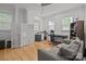 Bright office features hardwood floors, neutral walls, and a comfortable gray sofa at 2117 Middlebridge Ct, Fort Mill, SC 29715