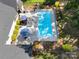 Aerial view of private pool with lounge area, manicured landscaping, and fenced yard at 2122 Goose Creek Farm Ln, Indian Trail, NC 28079