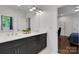 Modern bathroom featuring a double vanity with quartz counters, and a view into the bedroom at 2122 Goose Creek Farm Ln, Indian Trail, NC 28079
