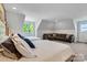 Spacious bedroom with two beds, sitting area, and great natural light perfect for relaxing at 2122 Goose Creek Farm Ln, Indian Trail, NC 28079