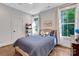 Bright bedroom with hardwood floors, natural light, and neutral decor creating a peaceful retreat at 2122 Goose Creek Farm Ln, Indian Trail, NC 28079
