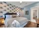 Well-lit bedroom with stylish wallpaper, hardwood floors, and ample closet space at 2122 Goose Creek Farm Ln, Indian Trail, NC 28079