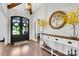 Welcoming foyer with hardwood floors, decorative table, and a view of the front doors at 2122 Goose Creek Farm Ln, Indian Trail, NC 28079