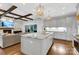 Open concept kitchen with a large island, stainless steel appliances, and hardwood floors at 2122 Goose Creek Farm Ln, Indian Trail, NC 28079