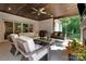 Relaxing outdoor patio with wood ceilings, a fireplace, comfortable seating, and a grill at 2122 Goose Creek Farm Ln, Indian Trail, NC 28079