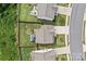Aerial view of a home showcasing the backyard, fence, driveway, and proximity to neighboring houses at 214 Hidden Lakes Rd, Statesville, NC 28677