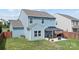 Spacious backyard with a well-maintained lawn, a patio and a charming gazebo with outdoor furniture at 214 Hidden Lakes Rd, Statesville, NC 28677