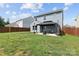 Spacious backyard with a well-maintained lawn, a patio and a charming gazebo with outdoor furniture at 214 Hidden Lakes Rd, Statesville, NC 28677