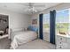 Well-lit bedroom with large window, carpet flooring, and neutral walls at 214 Hidden Lakes Rd, Statesville, NC 28677