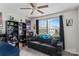 Bedroom with carpet, sofa, toys on shelves, and an exterior window at 214 Hidden Lakes Rd, Statesville, NC 28677