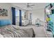 Neutral bedroom with carpet flooring, ceiling fan, ample natural light, and coordinating white furnishings at 214 Hidden Lakes Rd, Statesville, NC 28677