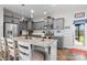Stylish kitchen with granite countertops, gray cabinets, pendant lighting, and stainless steel appliances at 214 Hidden Lakes Rd, Statesville, NC 28677