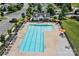 Overhead shot of a swimming pool with lounge chairs and umbrellas, as well as a pool house for residents at 214 Hidden Lakes Rd, Statesville, NC 28677