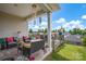 Large covered deck with seating and dining areas overlooking the backyard, perfect for outdoor living at 2473 Riparian Way, Denver, NC 28037