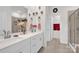 Bright bathroom with double sinks, modern fixtures, and a separate shower room at 2473 Riparian Way, Denver, NC 28037