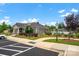 Community clubhouse with ample parking, manicured landscaping, and pool access, creating a welcoming gathering space at 2473 Riparian Way, Denver, NC 28037
