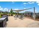 Community pool area features shaded seating and manicured landscaping, ideal for residents to relax and socialize at 2473 Riparian Way, Denver, NC 28037
