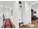 Hallway boasts hardwood floors and a convenient built-in storage nook at 2473 Riparian Way, Denver, NC 28037
