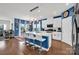 Kitchen with a large island with bar stools, modern appliances, and opens to the living room at 2473 Riparian Way, Denver, NC 28037
