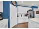 Modern kitchen with white cabinets, stainless steel appliances, and a stylish backsplash at 2473 Riparian Way, Denver, NC 28037