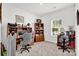 Well-lit home office with built-in shelving and ample desk space for productivity at 2473 Riparian Way, Denver, NC 28037