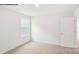 Bright bedroom features neutral carpet, a window for natural light, and fresh white walls at 248 Miramar Dr, York, SC 29745