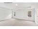 A bright bedroom featuring neutral carpet, two windows, and trey ceiling at 248 Miramar Dr, York, SC 29745