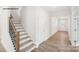 Inviting entryway with hardwood floors and staircase, offering a glimpse into the home at 248 Miramar Dr, York, SC 29745