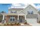 Charming two-story home featuring stone accents and a welcoming front porch at 248 Miramar Dr, York, SC 29745