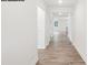 Hallway with hardwood floors and white trim leading to other rooms in the house at 248 Miramar Dr, York, SC 29745