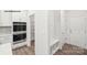 Modern kitchen featuring stainless steel double ovens and built-in shelving at 248 Miramar Dr, York, SC 29745