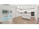 Bright, open kitchen with stainless appliances, an island, and sliding door access to the outside at 248 Miramar Dr, York, SC 29745