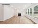 Bright living room featuring a fireplace, wood floors, recessed lighting, and large windows offering ample natural light at 248 Miramar Dr, York, SC 29745