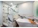 Luxurious bathroom with a soaking tub, marble accents, and a glass-enclosed shower at 3041 Shallowood Ln, Charlotte, NC 28277