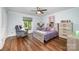 Cozy bedroom with a rocker, window, and furniture, creating a comfortable space at 3041 Shallowood Ln, Charlotte, NC 28277