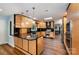 Modern kitchen featuring wood cabinets, granite countertops, and stainless steel appliances at 3041 Shallowood Ln, Charlotte, NC 28277