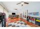 Spacious playroom with tile floors, ceiling fans, and colorful decorations at 3041 Shallowood Ln, Charlotte, NC 28277