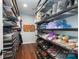 Organized walk-in closet featuring shelving and storage for clothes, shoes, and accessories at 3041 Shallowood Ln, Charlotte, NC 28277