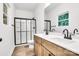 Stylish bathroom with dual sink vanity, quartz counters, and sleek glass-enclosed shower at 354 Moore Ave, Mooresville, NC 28115