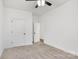 Carpeted bedroom with two closet doors at 354 Moore Ave, Mooresville, NC 28115