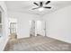Large bedroom with ceiling fan, carpet flooring and ensuite bathroom at 354 Moore Ave, Mooresville, NC 28115