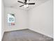 Well-lit bedroom with carpet floors and a large window at 354 Moore Ave, Mooresville, NC 28115