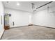 A spacious garage with water heater and ample space for parking and storage at 354 Moore Ave, Mooresville, NC 28115