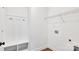 A functional laundry room with built-in storage, utility connections and convenient shelving for organization at 354 Moore Ave, Mooresville, NC 28115