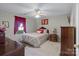 Comfortable bedroom featuring a ceiling fan and carpeted floors at 4024 Town Center Rd, Harrisburg, NC 28075